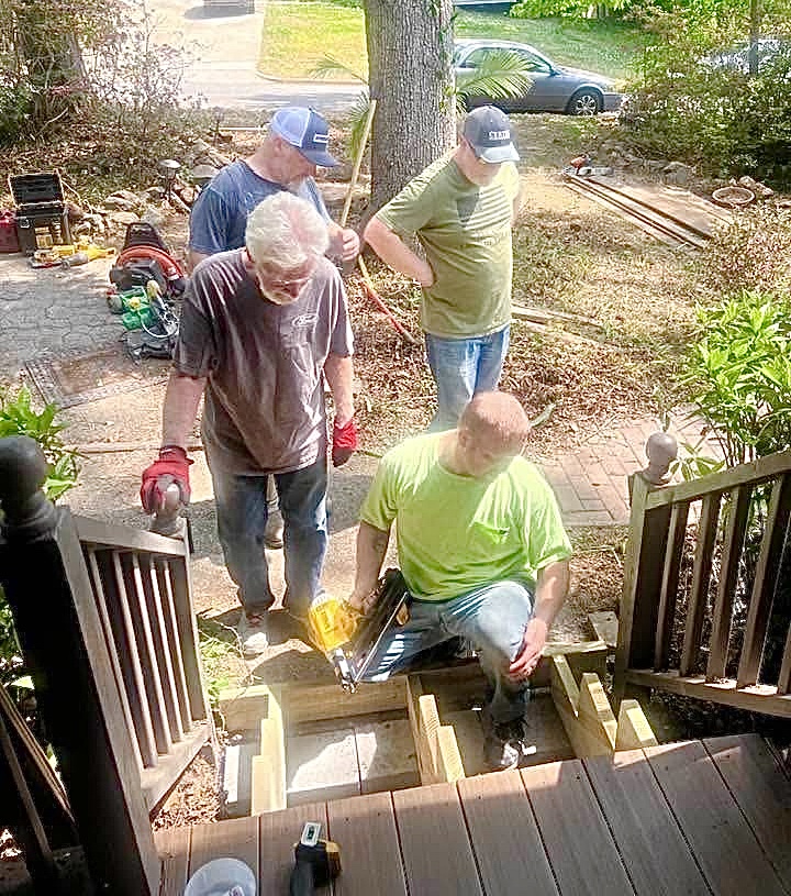 Men of Purpose volunteers rebuilding stairs