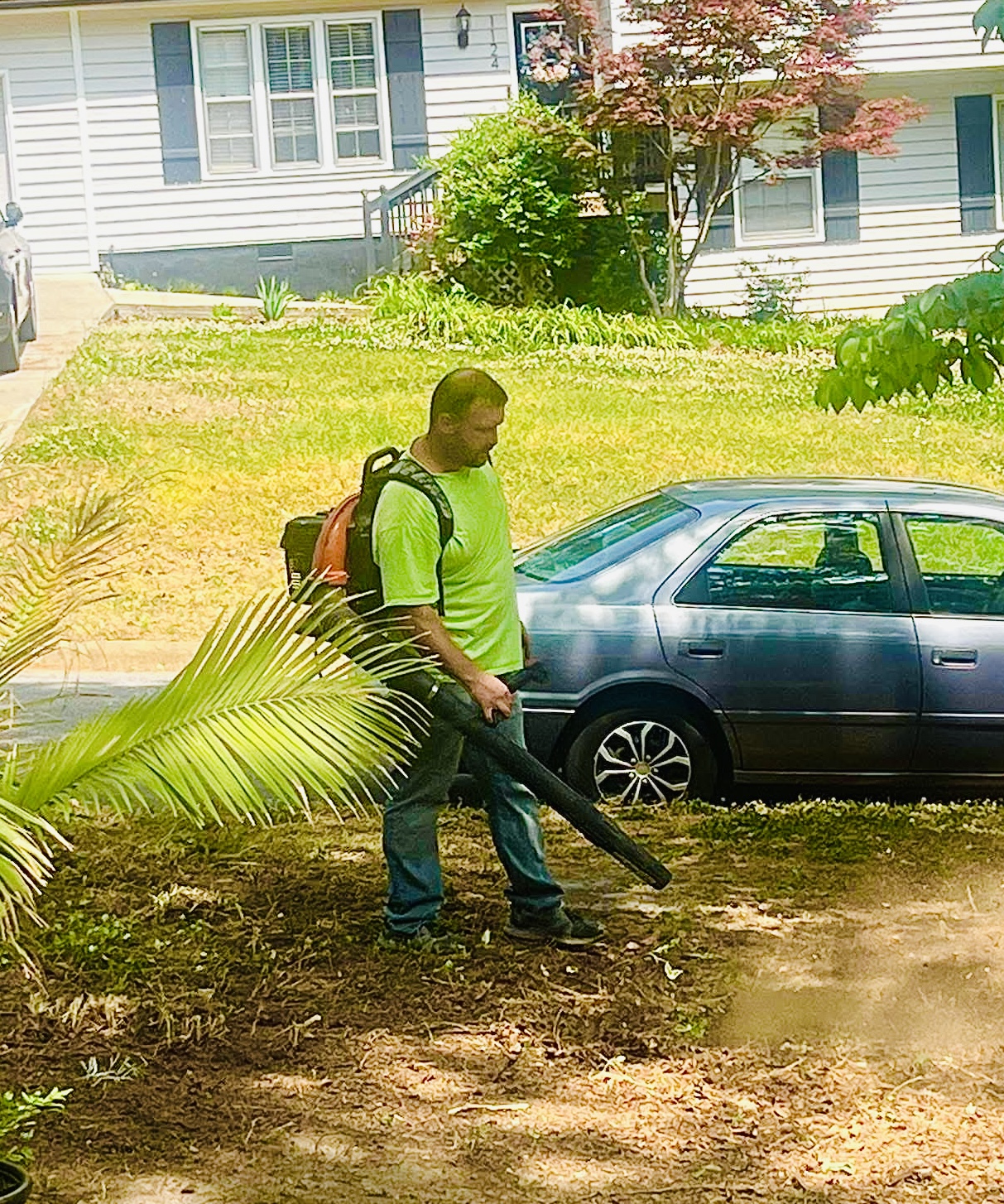 Men of Purpose volunteer doing yard work