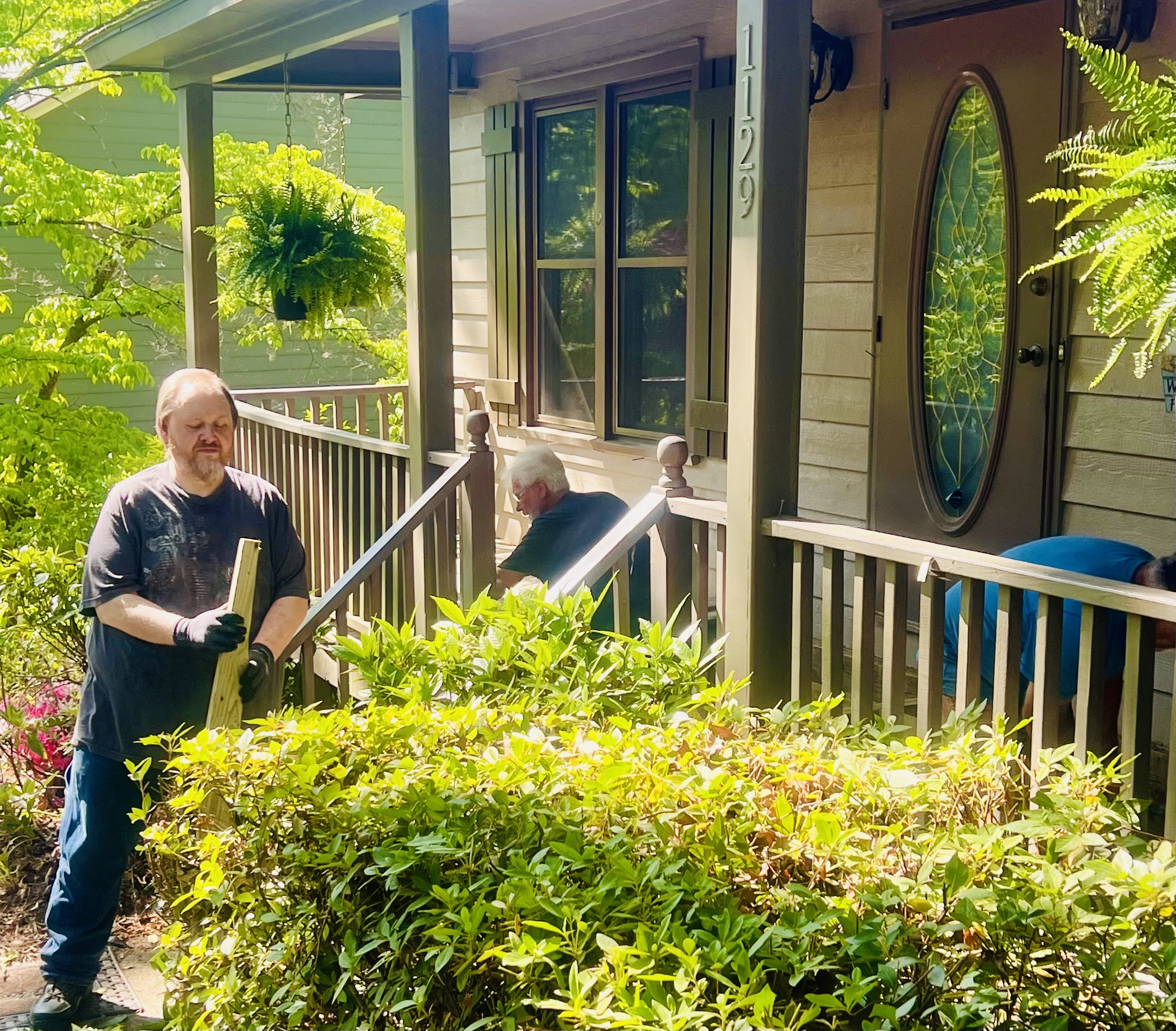 Men of Purpose volunteers working on a porch project