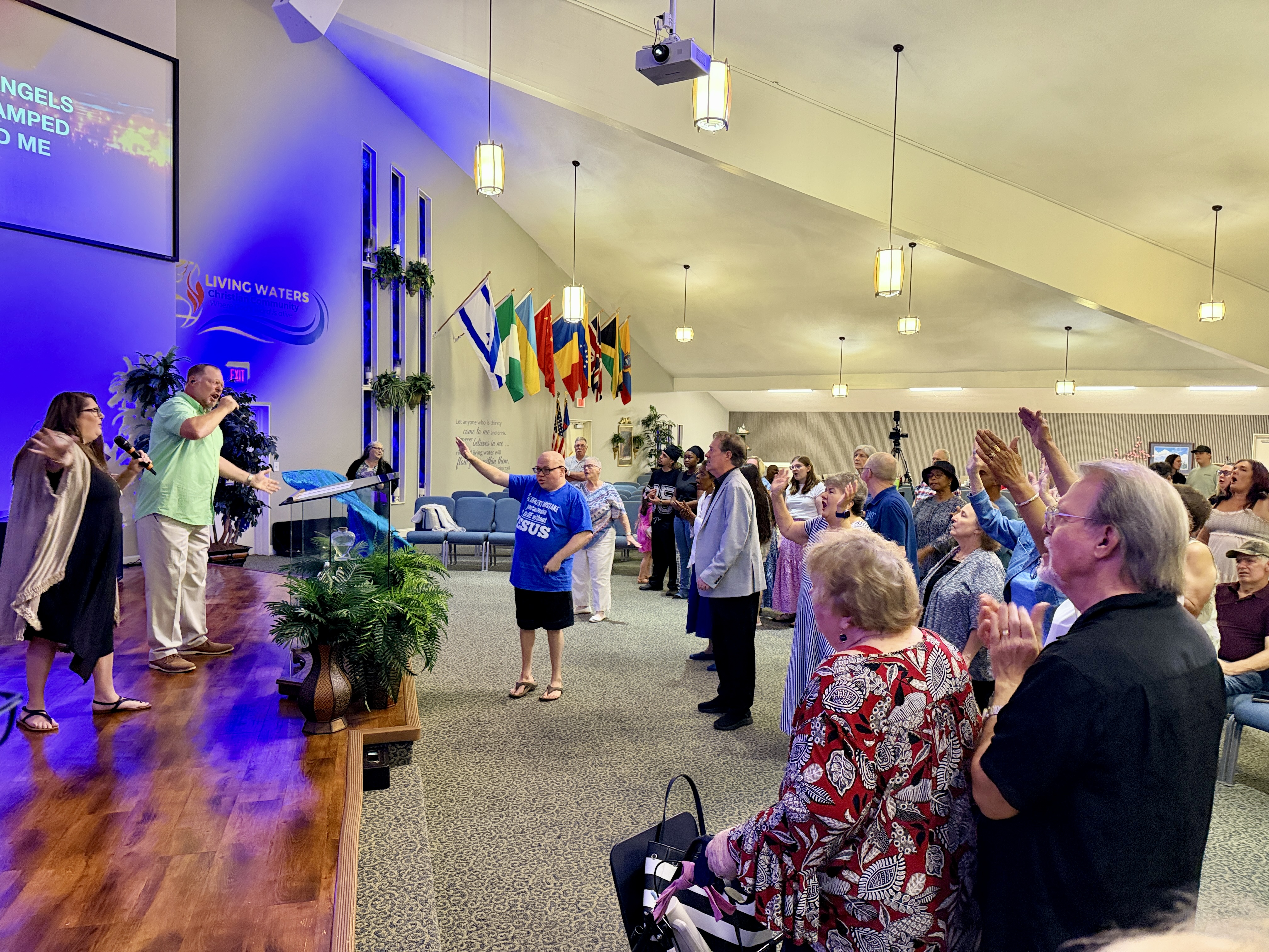 Congregation worshipping during a Sunday service at Living Waters